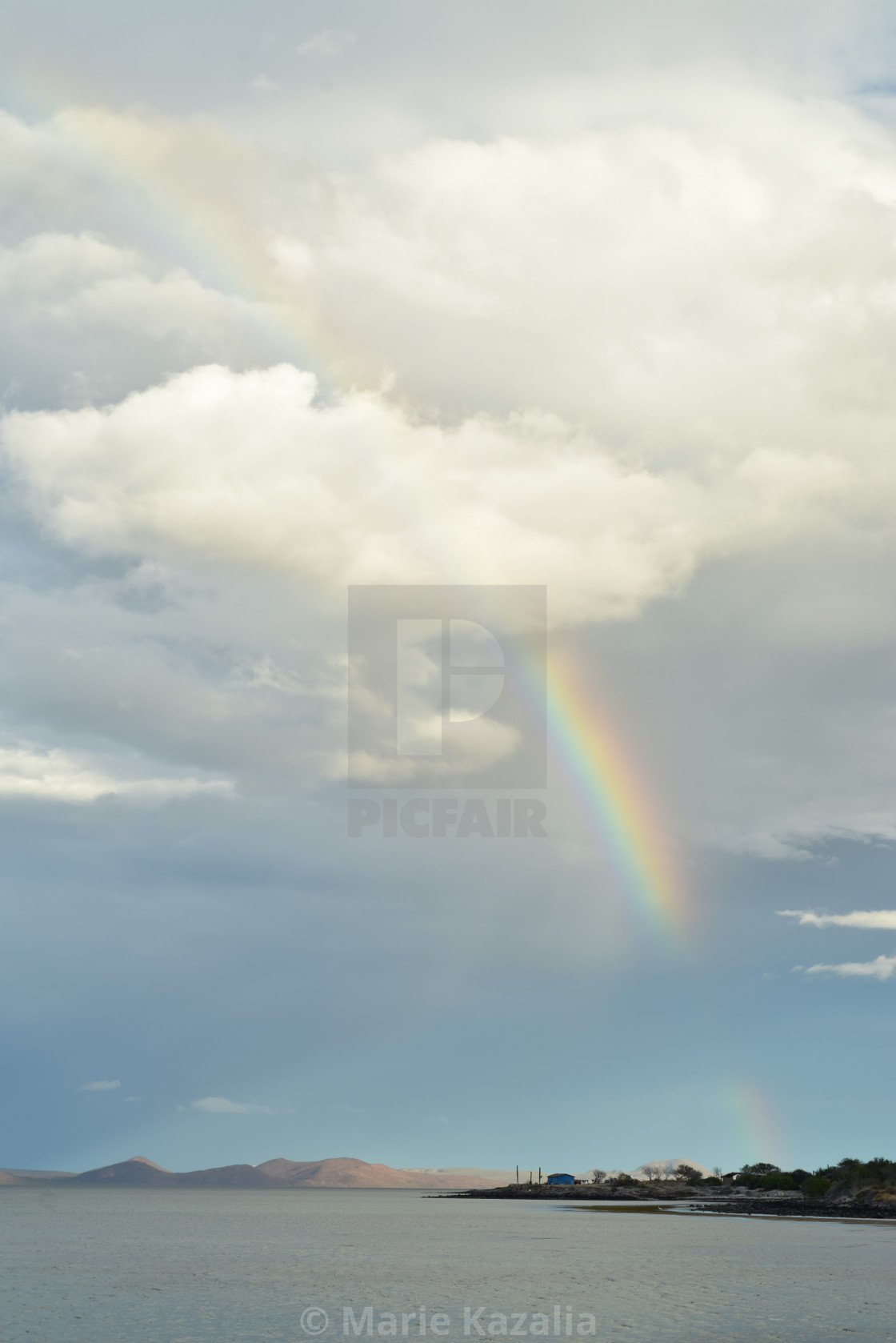"rainbow in cloudy sky over boat on water of Sea of Cortez, Baja, Mexico" by Marie Kazalia - $15.16 "rainbow in cloudy sky over boat on water of Sea of Cortez, Baja, Mexico" stock image