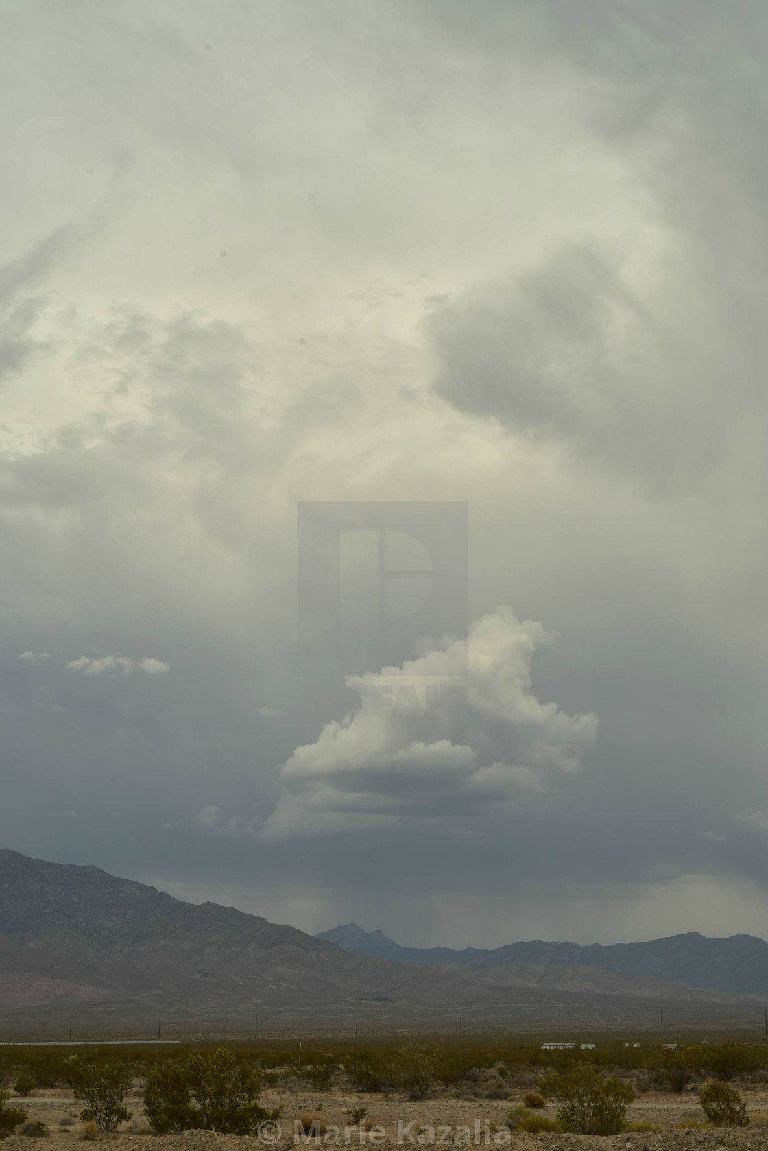 "rain clouds in vast sky over Mojave Desert landscape and houses in town of Pahrump, Nevada" by Marie Kazalia - $15.29 "rain clouds in vast sky over Mojave Desert landscape and houses in town of Pahrump, Nevada" stock image