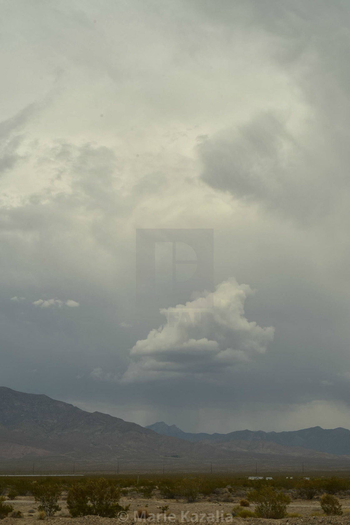 "rain clouds in vast sky over Mojave Desert landscape and houses in town of Pahrump, Nevada" by Marie Kazalia - $15.29 "rain clouds in vast sky over Mojave Desert landscape and houses in town of Pahrump, Nevada" stock image