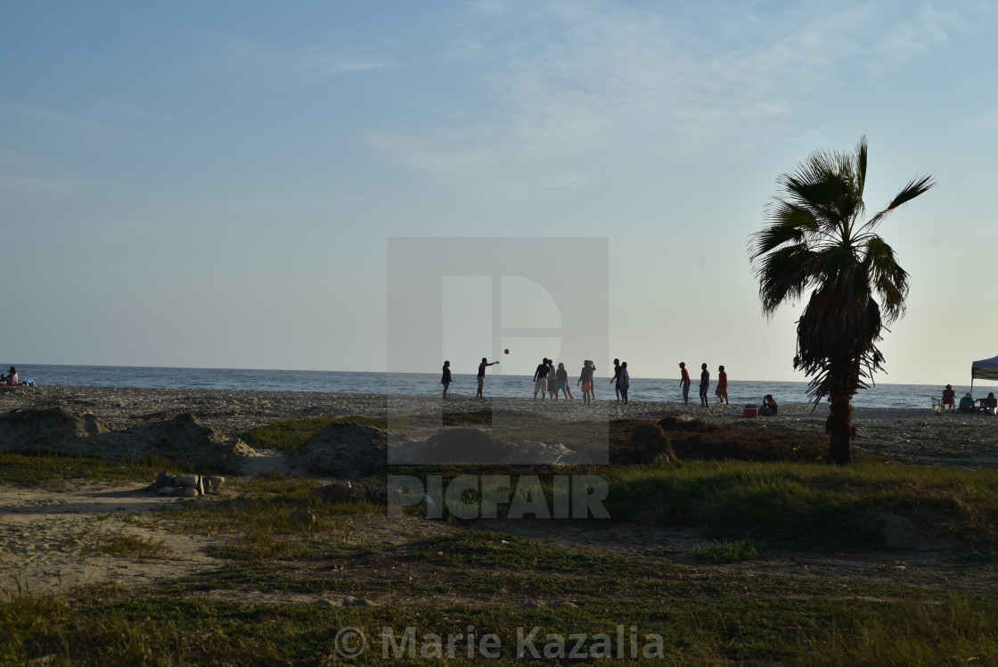 "group of young men in silhouette playing volleyball on Baja beach, Mexico" by Marie Kazalia - $15.44 "group of young men in silhouette playing volleyball on Baja beach, Mexico" stock image