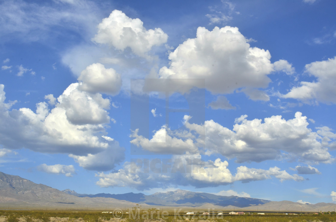 "cumulus clouds over mountain range, valley, row of houses in Mojave Desert town Pahrump, Nevada, USA" by Marie Kazalia - $15.16 "cumulus clouds over mountain range, valley, row of houses in Mojave Desert town Pahrump, Nevada, USA" stock image
