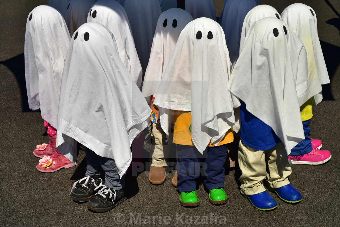"Halloween ghost figures wearing kids shoes!" by Marie Kazalia - $15.16 "Halloween ghost figures wearing kids shoes!" stock image