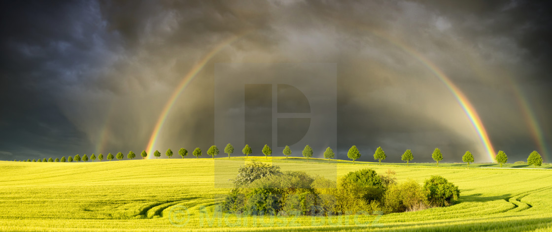 "sun,rainfal and rainbow" stock image