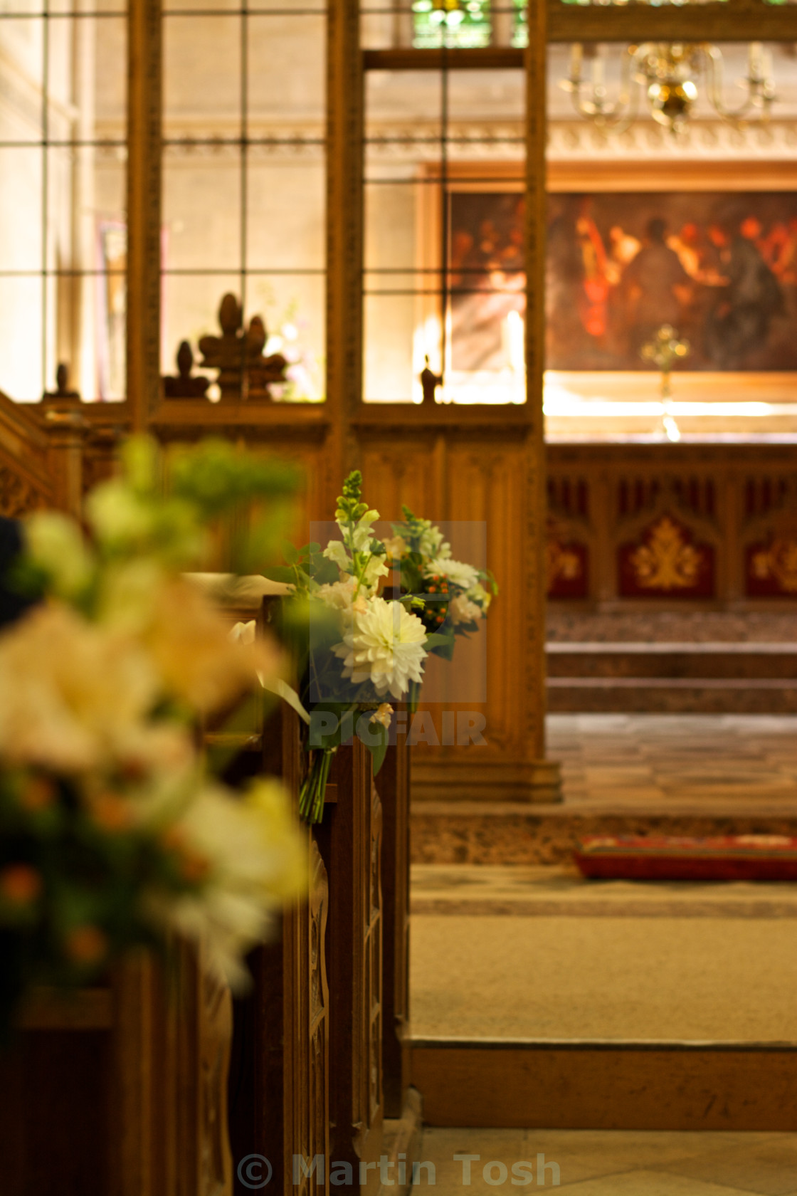 "Wedding flowers-on church pews" stock image