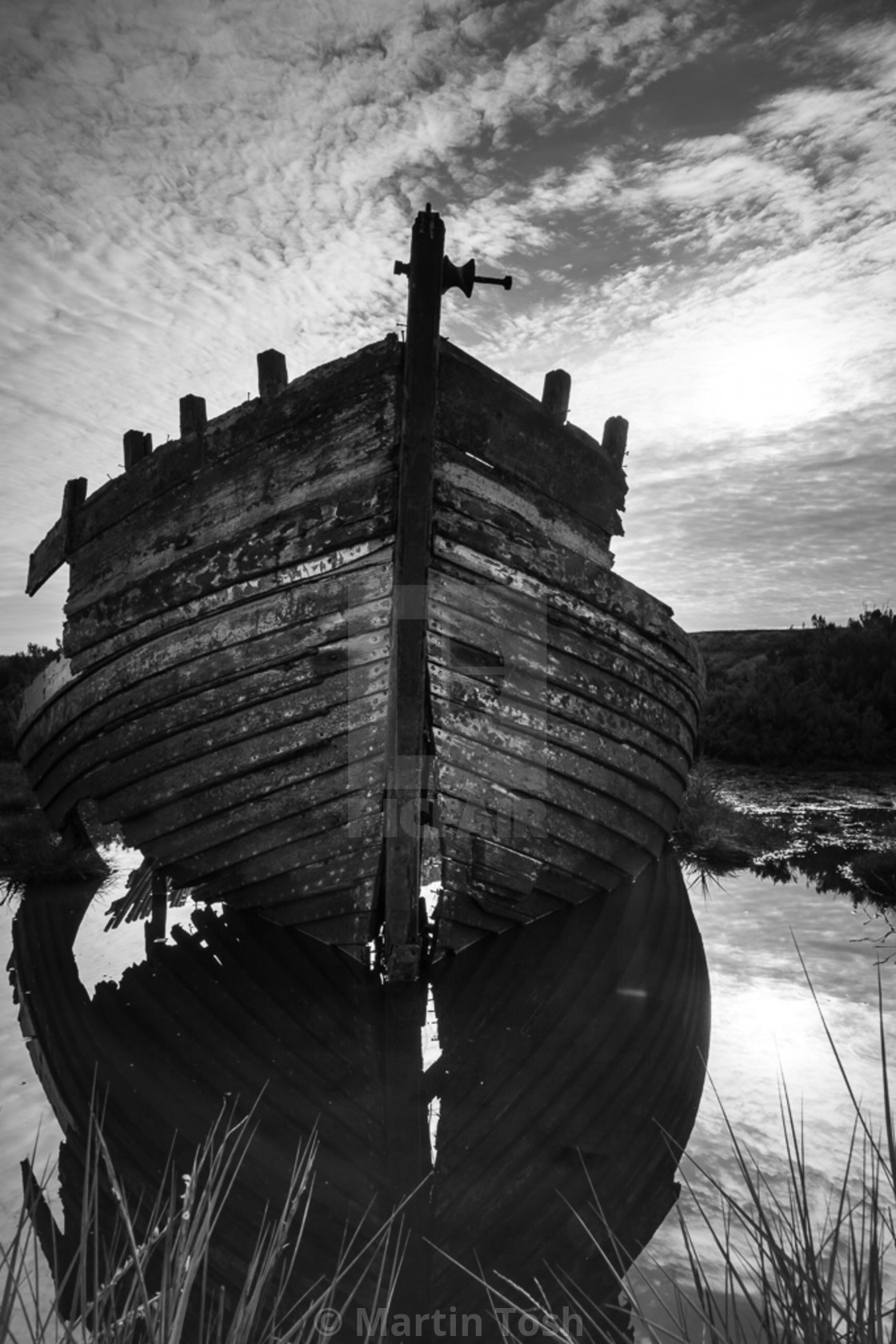 "Derelict rowing boat" stock image