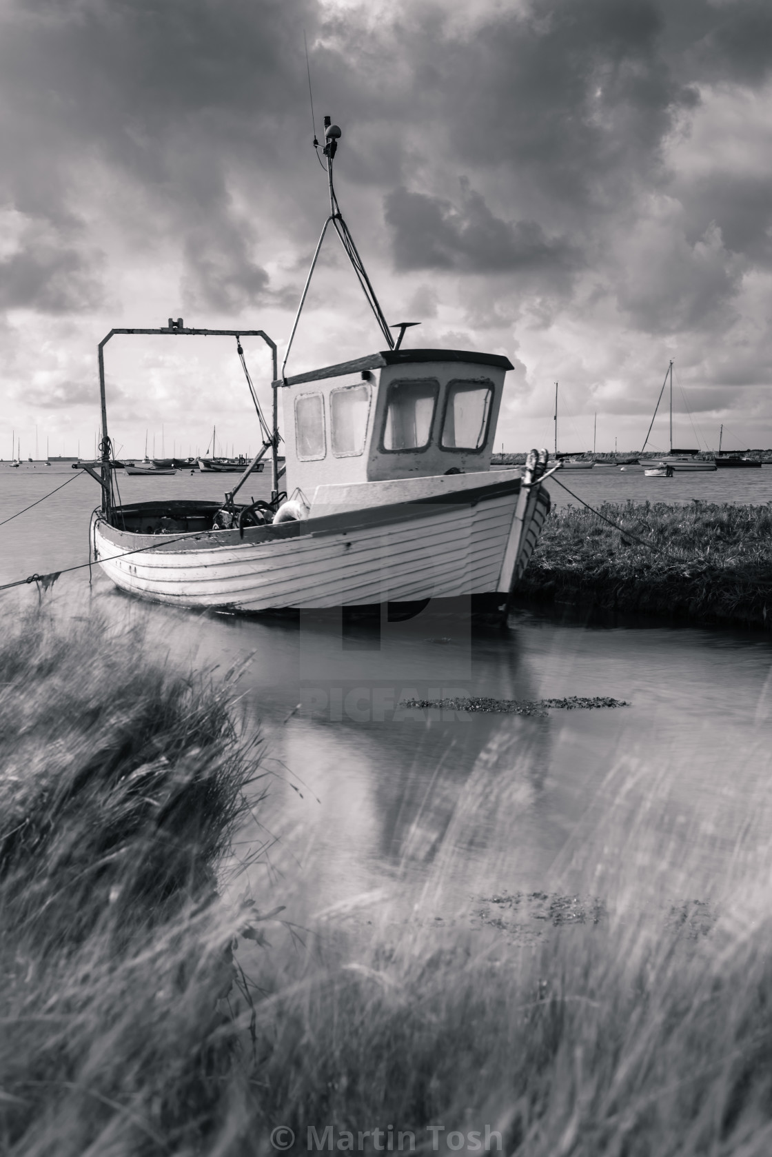 "Fishing boat in salt marsh" stock image