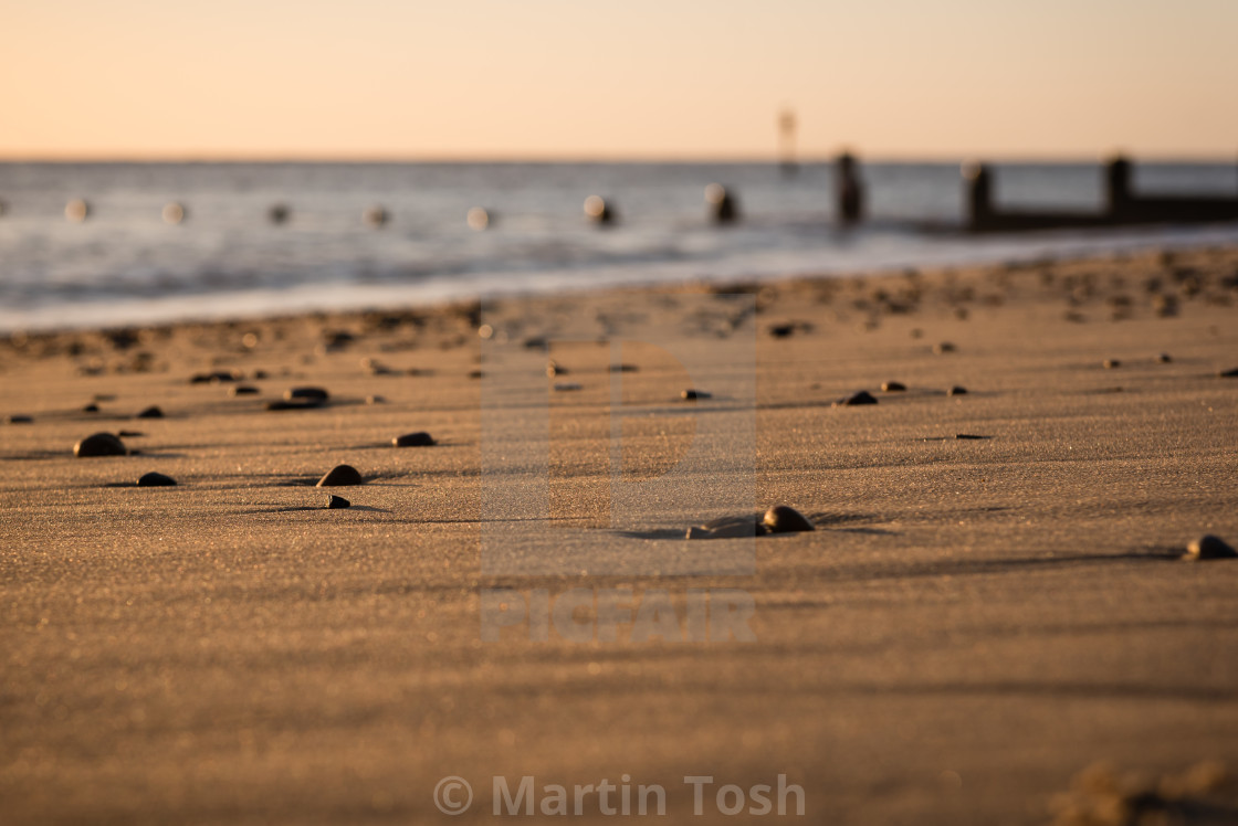 "sand and pebble beach" stock image