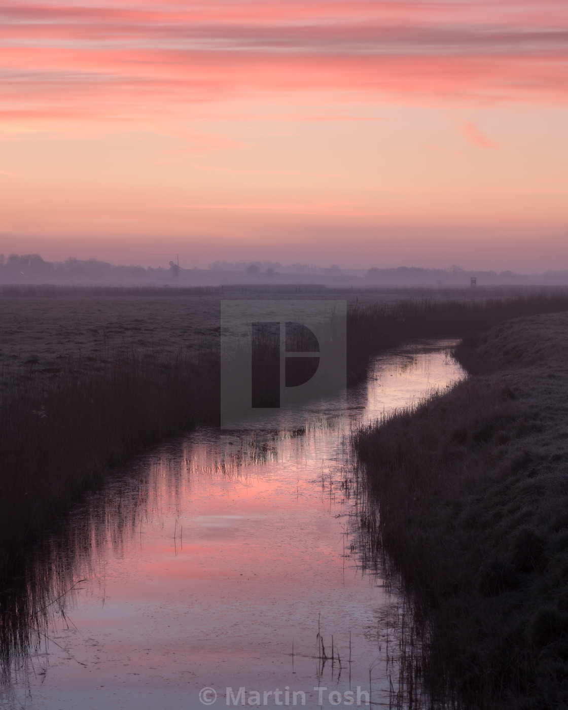 "Start of day at St Benet's Abbey I. Pink sunrise over creek i" stock image