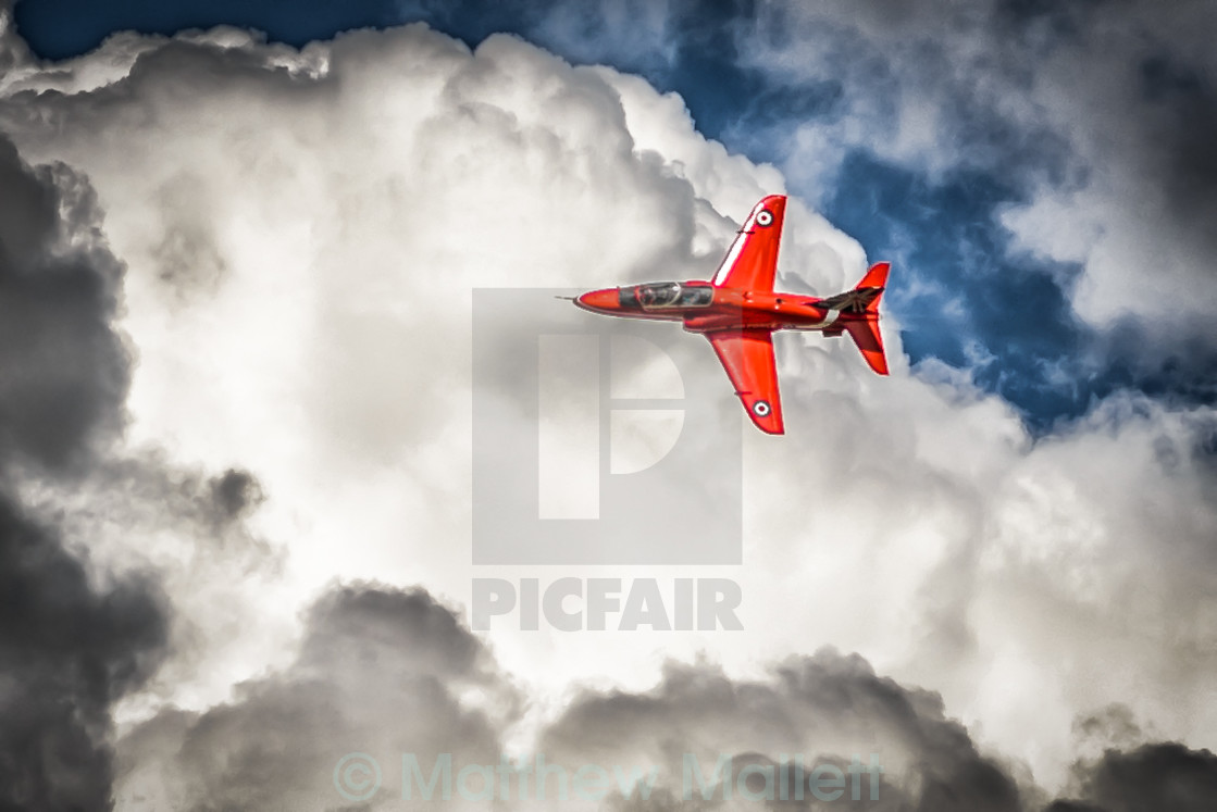 "Red Arrow In Action Over the Clouds" stock image