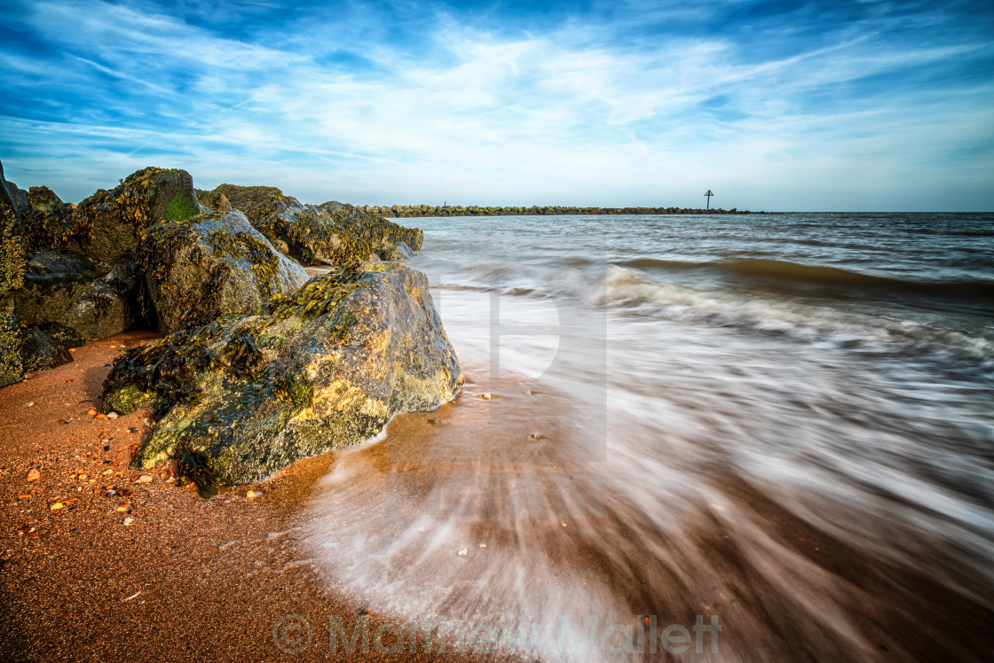 "Incoming waves on an ebbing Tide" stock image