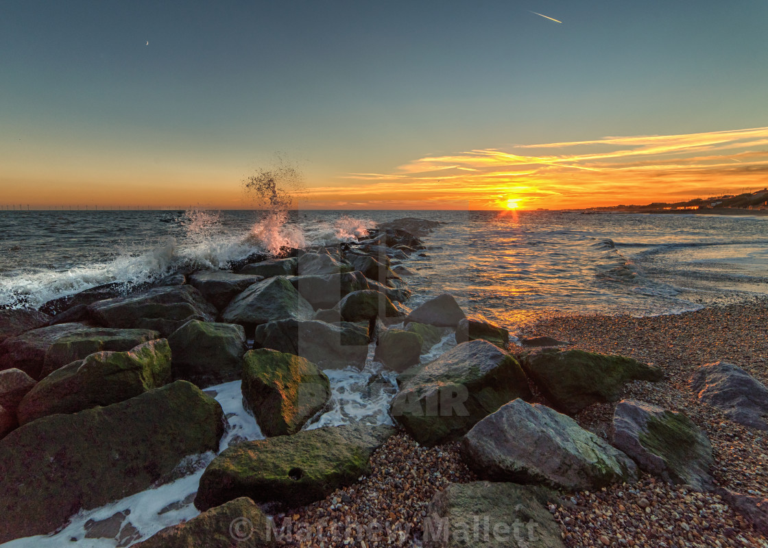 "Rough December Sunset on Clacton Beach" stock image