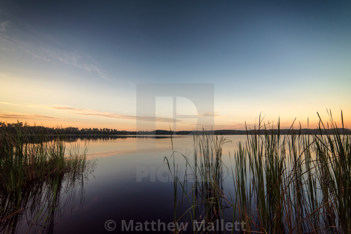 "Tranquil Sunrise Over Florida Lake" stock image