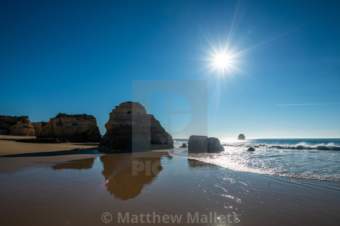 "Sun Over Praia Da Rocha Beach" stock image