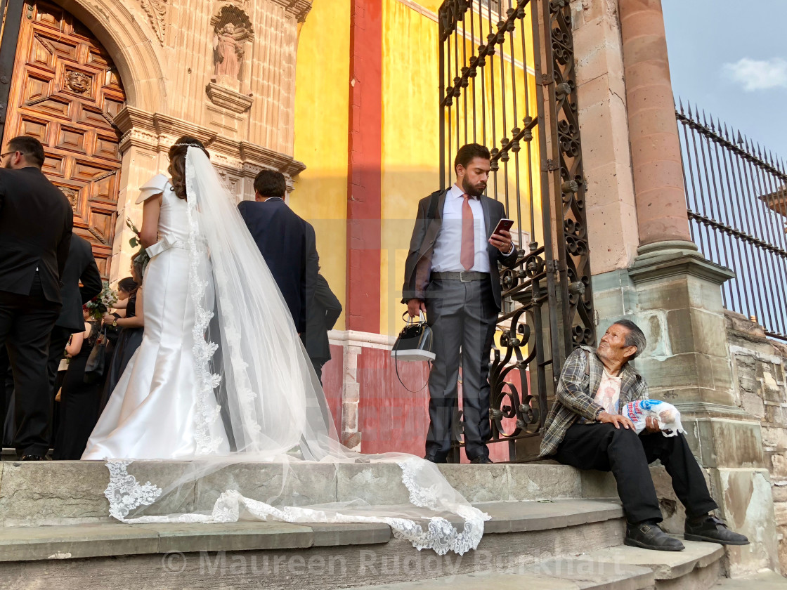 "A Wedding and the Street Seller" stock image