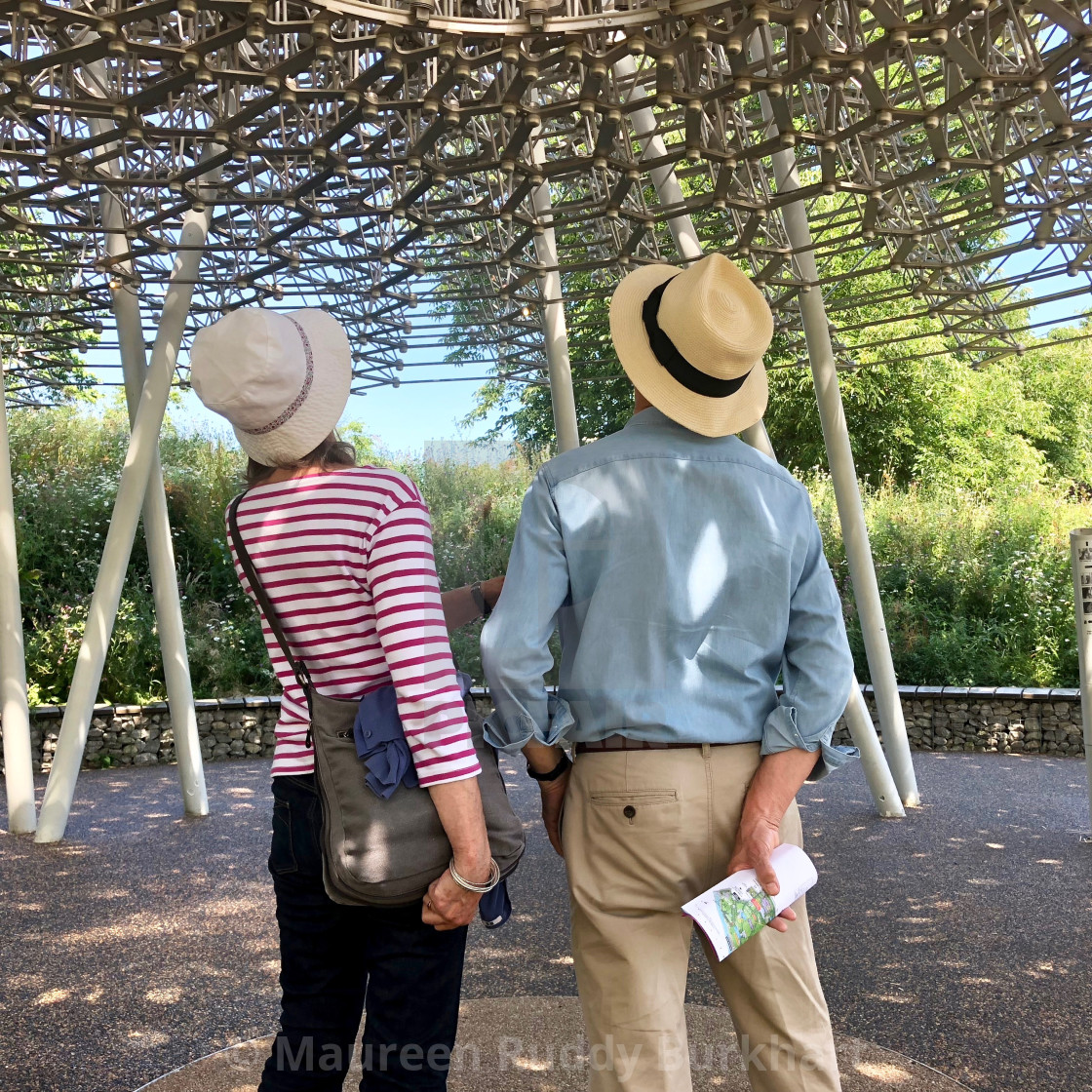 "A Couple With Hats at the Hive" by Maureen Ruddy Burkhart - $31.12 "A Couple With Hats at the Hive" stock image