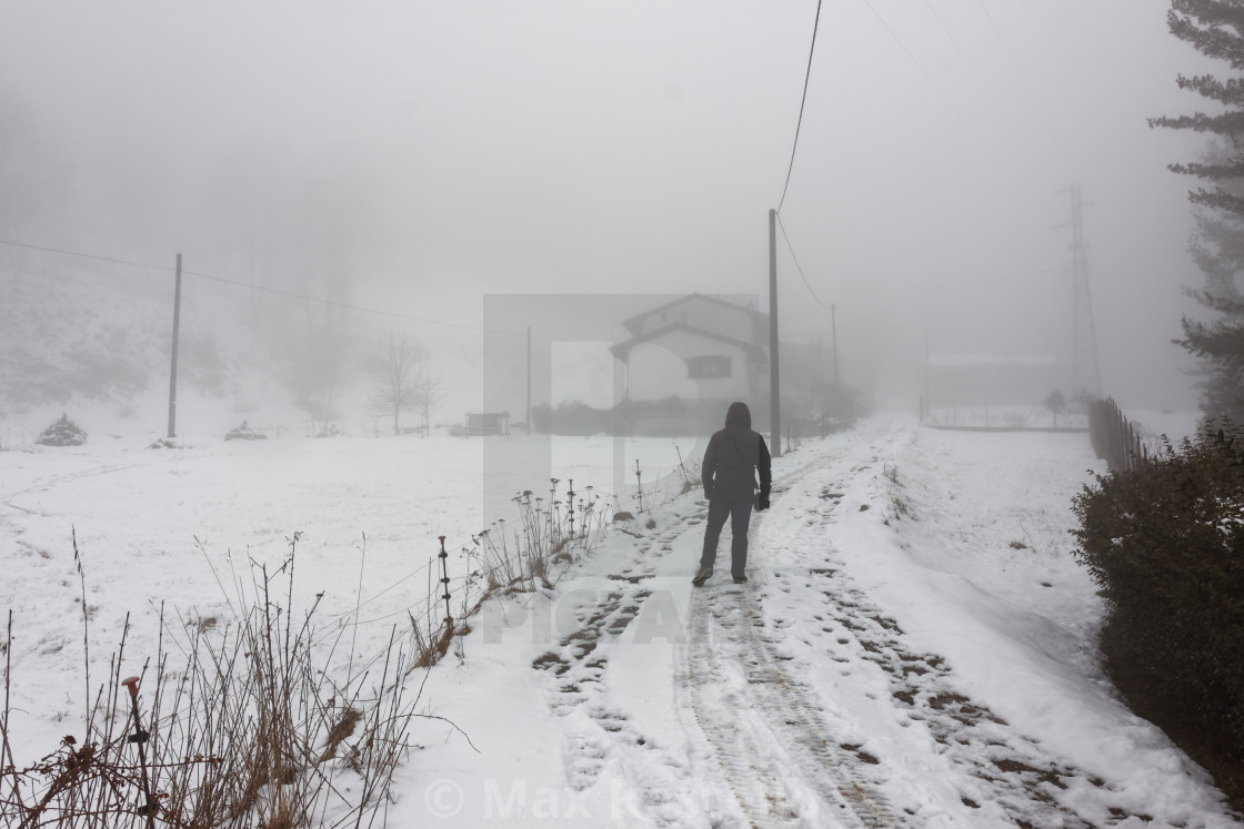 Lonely Man Walking To Home In The Winter Fog With Snowy Landscape License Download Or Print For 12 40 Photos Picfair