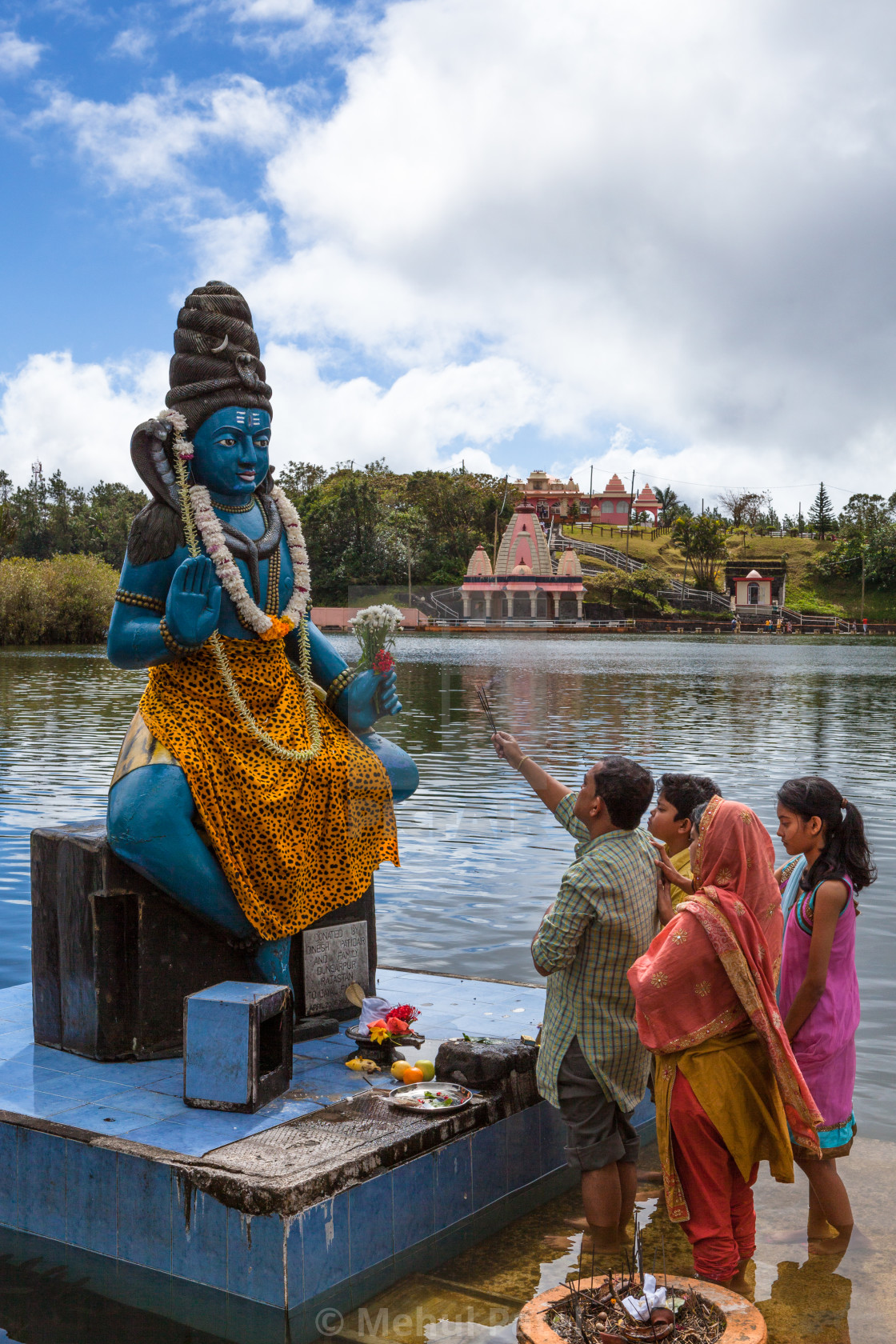 Family Offering Prayer To Lord Shiva At Temple By The Holy Lake License Download Or Print For 25 00 Photos Picfair See more ideas about lord shiva, shiva, lord siva.