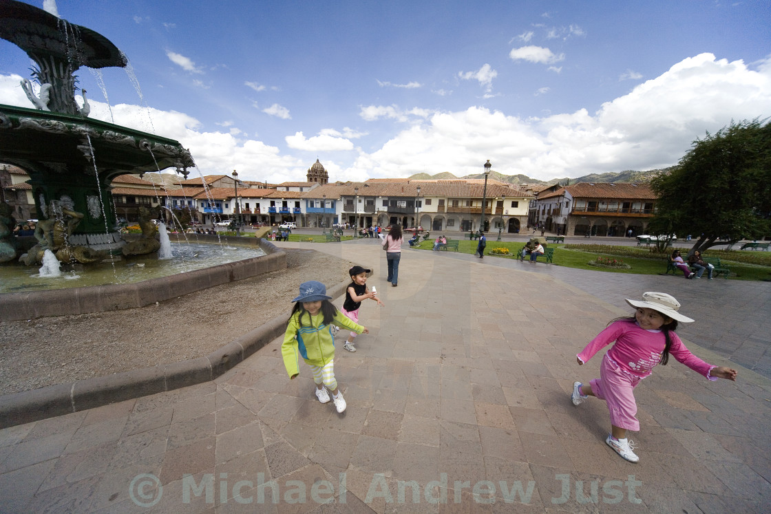 "PLAYING AT THE FOUNTAIN IN CUZCO" stock image