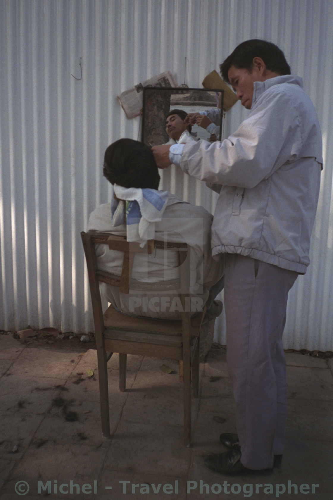 "Hanoi Street Barber" by Michel - Travel Photographer - £16.62 "Hanoi Street Barber" stock image