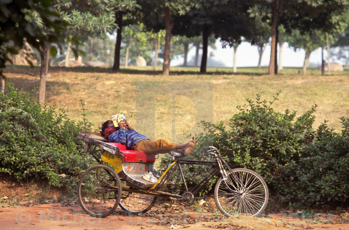 "Rickshaw Rider Relaxing" by Michel - Travel Photographer - £16.62 "Rickshaw Rider Relaxing" stock image