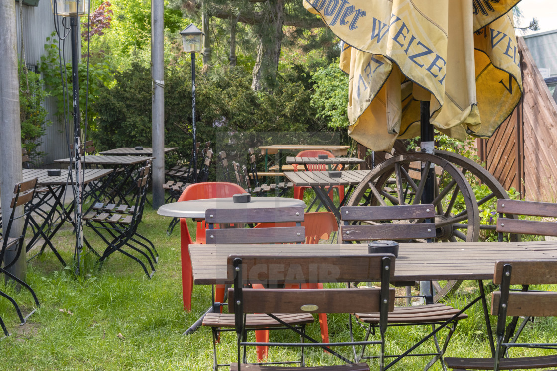 View Into A Beer Garden With Various Mixed Garden Furniture And Old Wooden Cart Wheels License Download Or Print For 31 00 Photos Picfair
