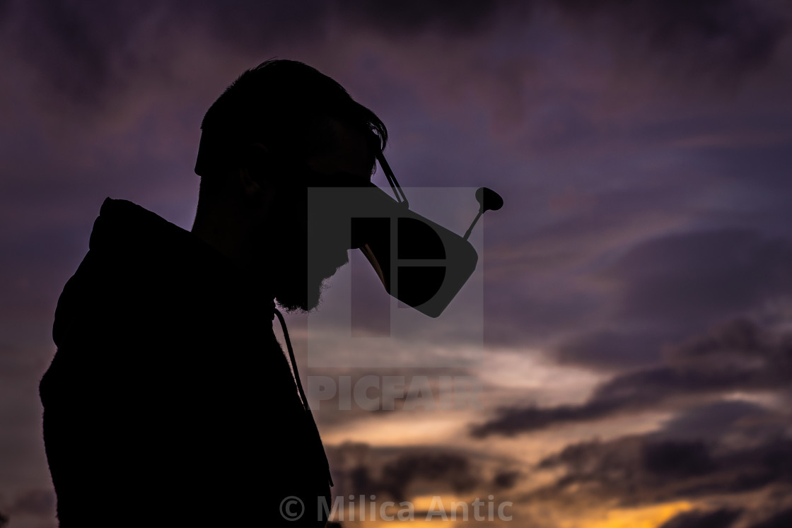 "Silhouette of a man with drone goggles" by Milica Antic - £12.40 "Silhouette of a man with drone goggles" stock image