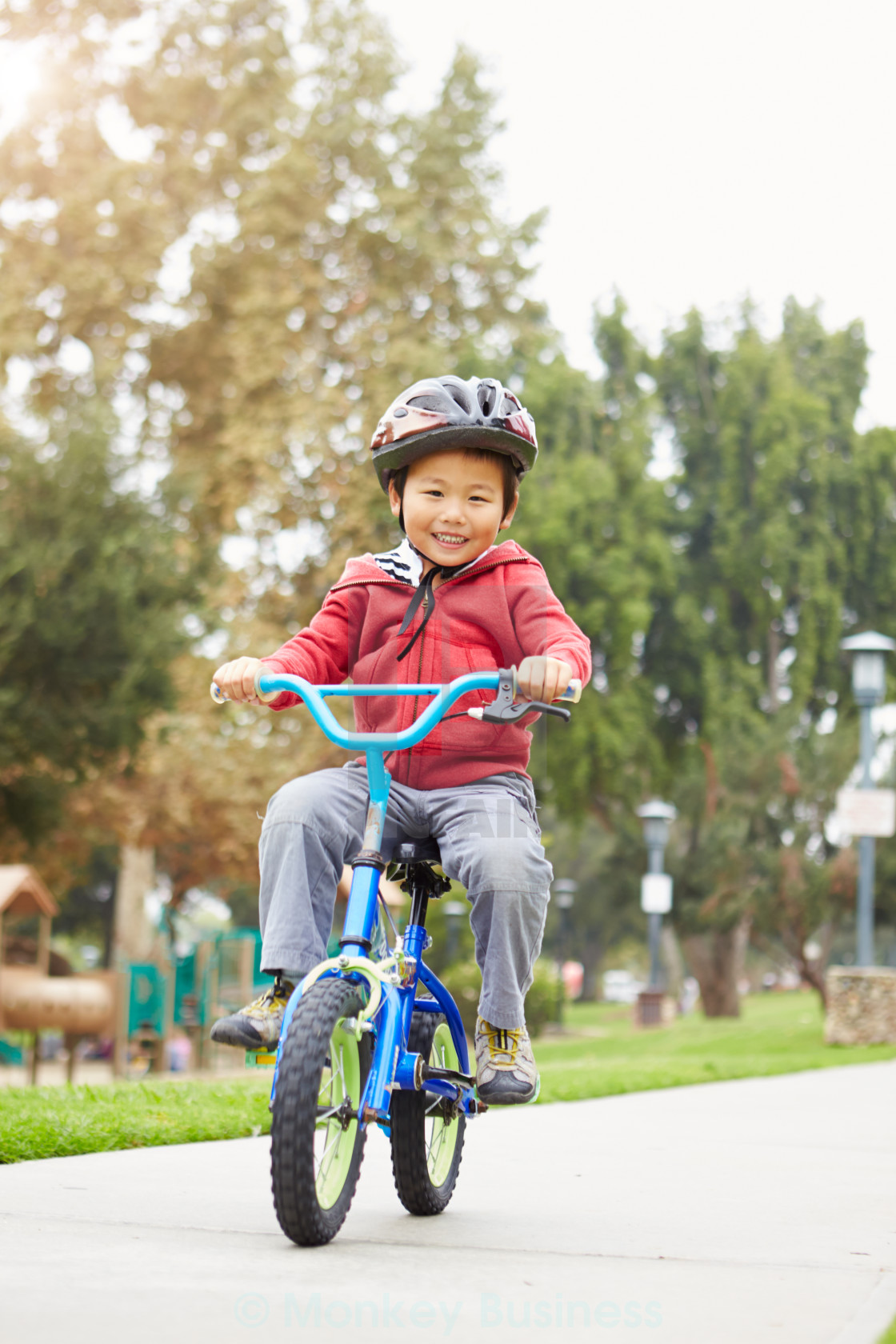 small boy riding bike