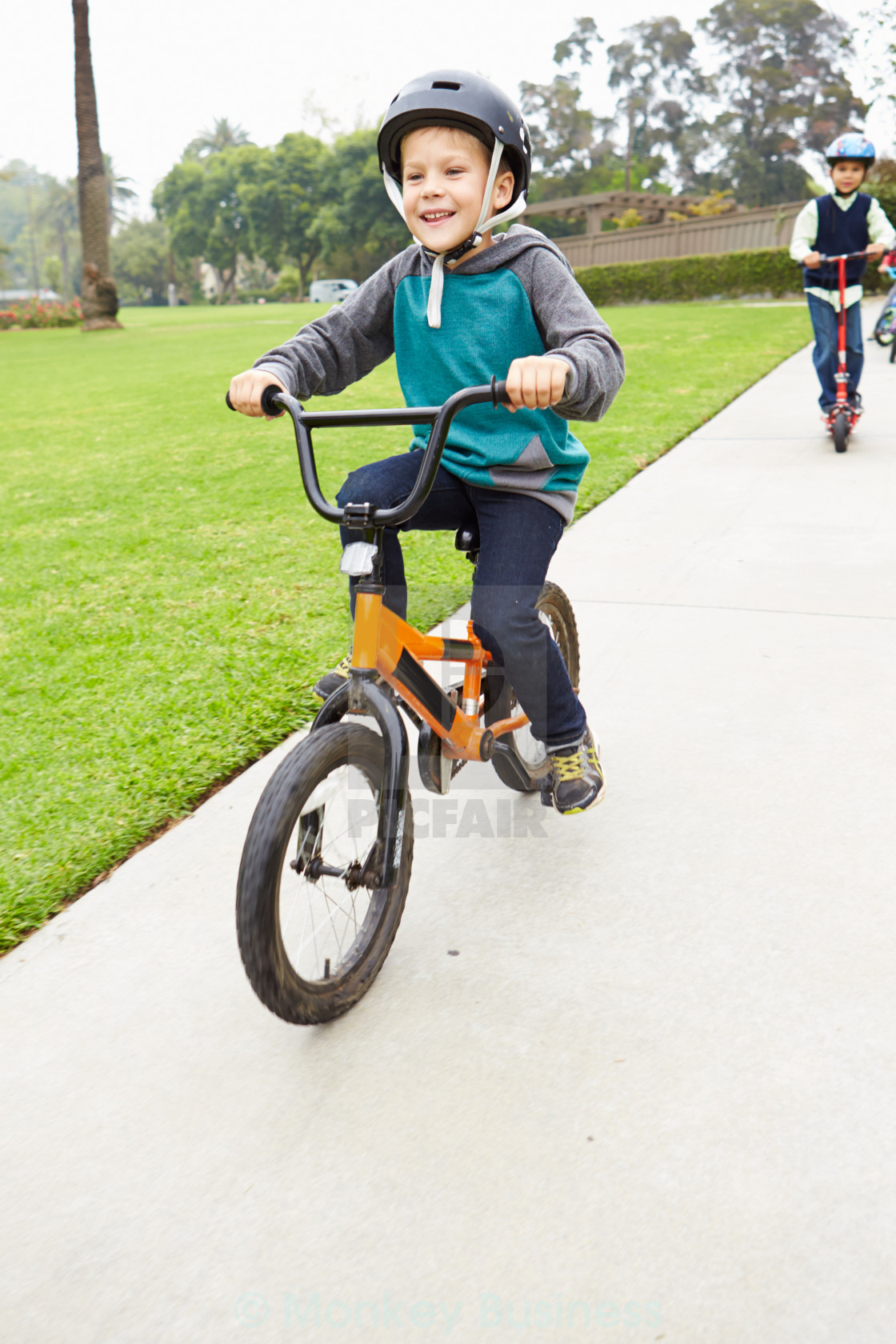 small boy riding bike