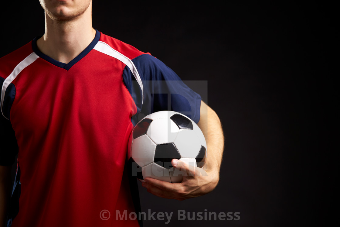 Close Up Of Professional Soccer Player With Ball In Studio License Download Or Print For 14 Photos Picfair