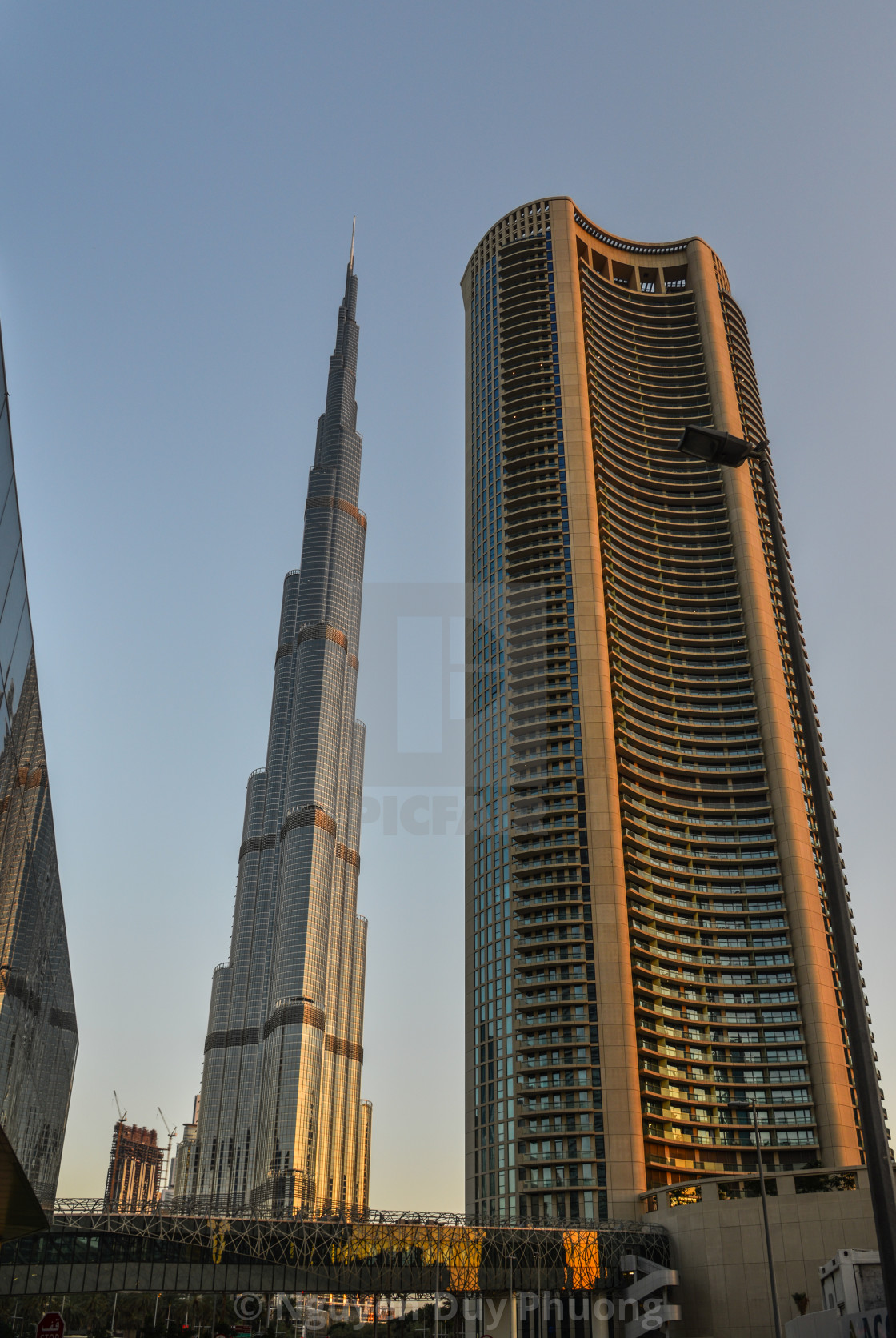 View Of Burj Khalifa At Sunset In Dubai License Download