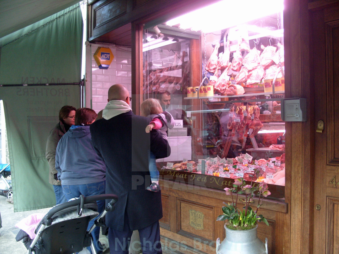 "Waiting at the butcher's shop" stock image