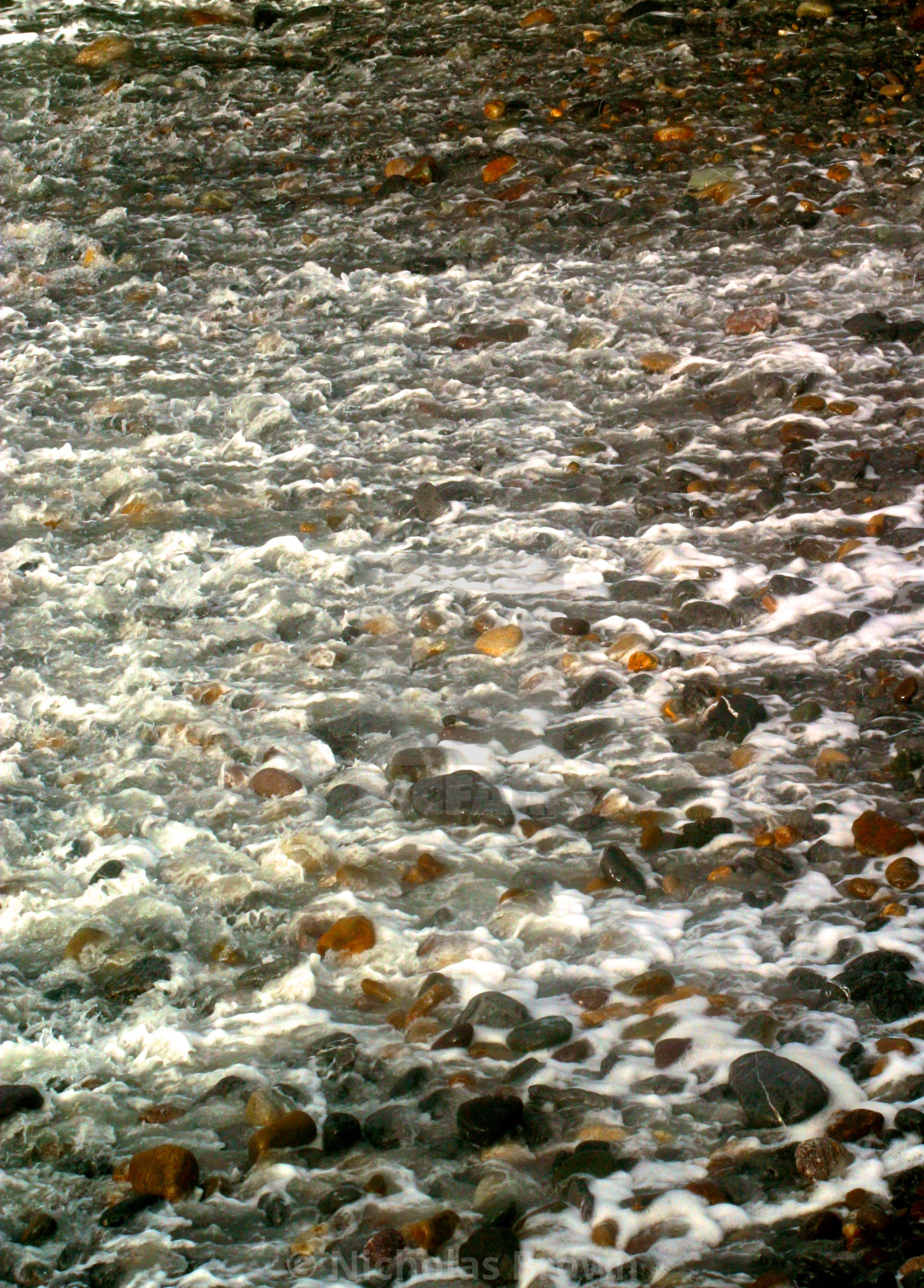 "Tide against shingle" stock image