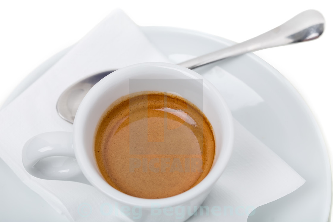 "Full espresso cup on plate." stock image