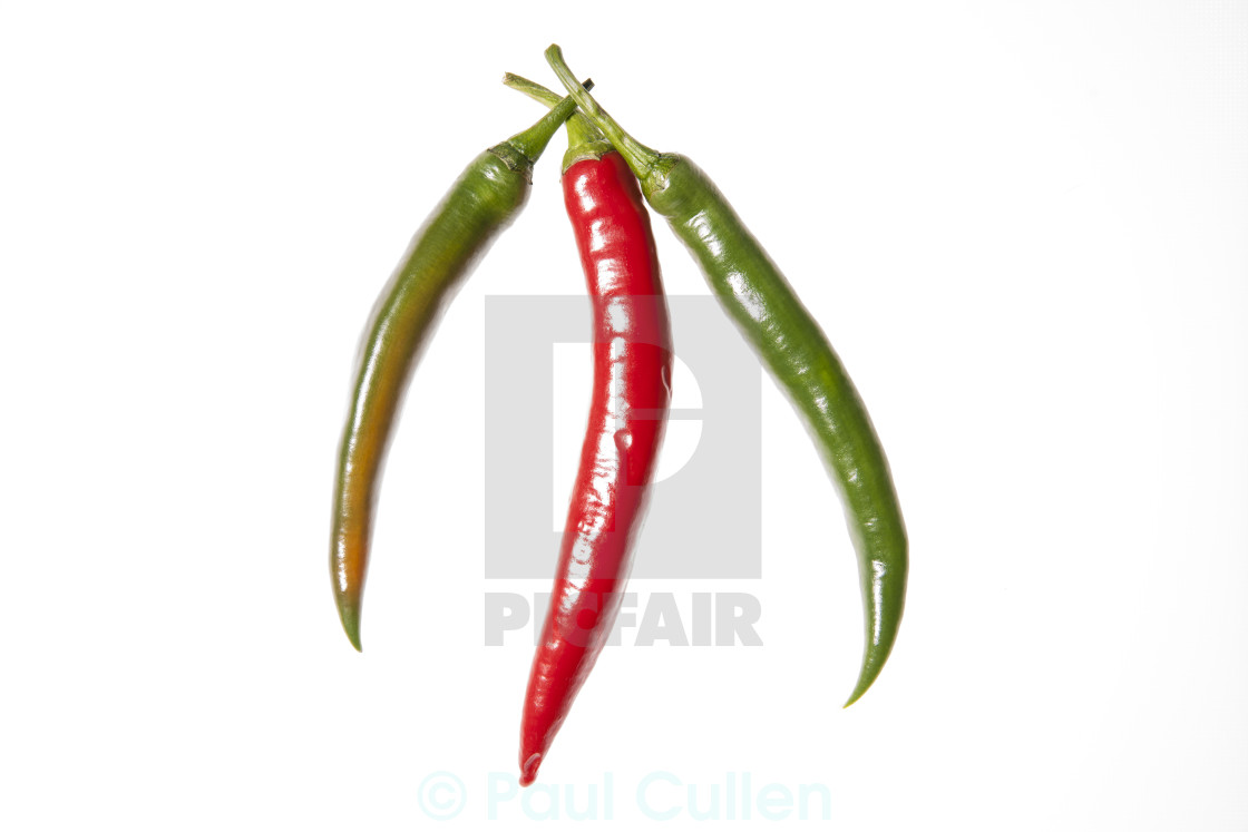 "Three peppers arranged" stock image