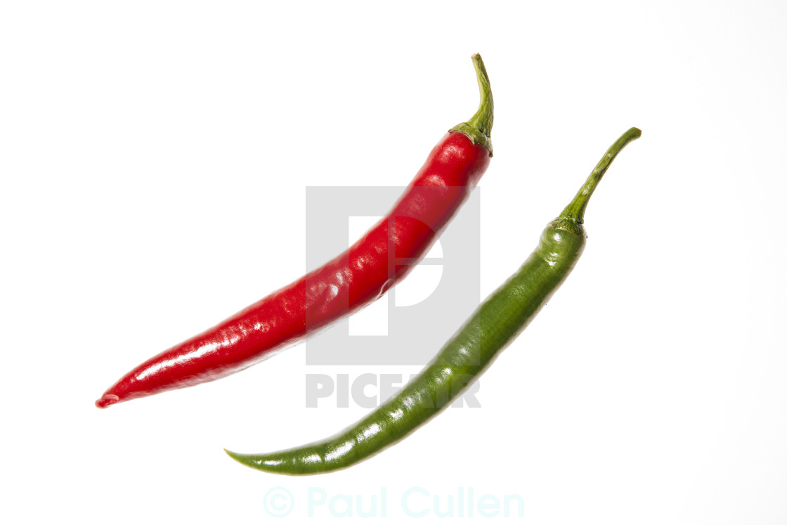 "Two long chilli peppers arranged diagonally" stock image