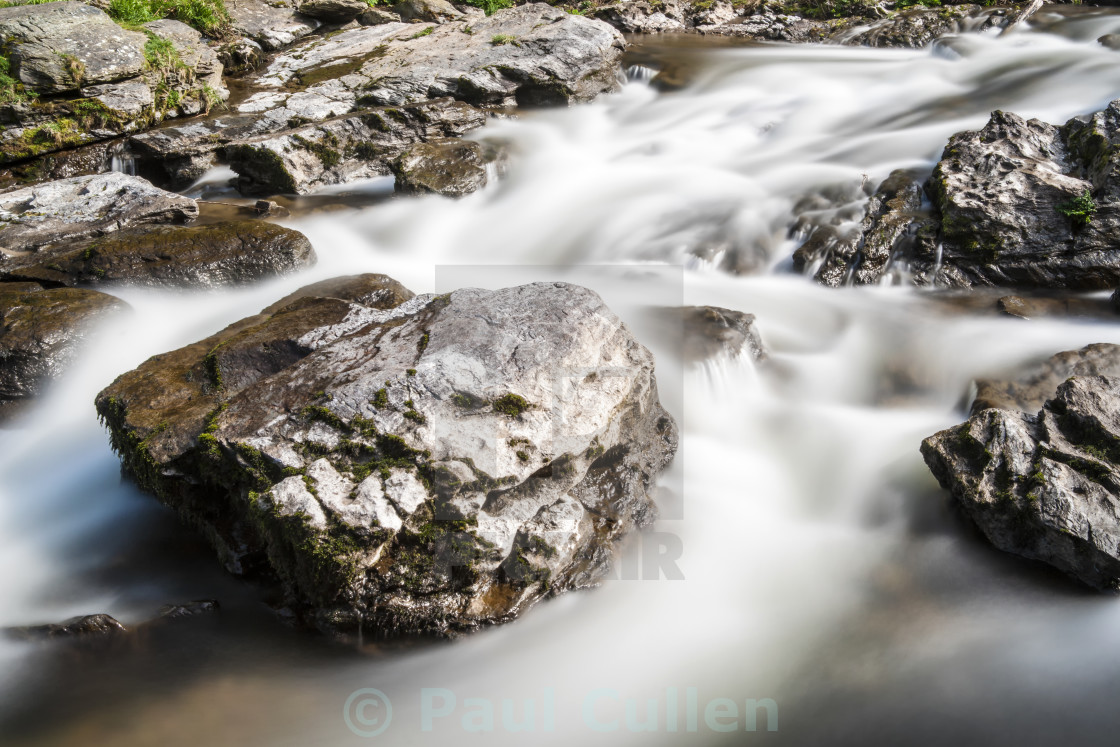 "Rocks in the stream - Abstract." stock image