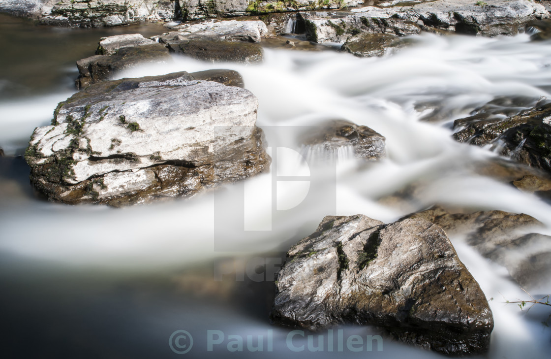 "Rocks in the river Lyn." stock image