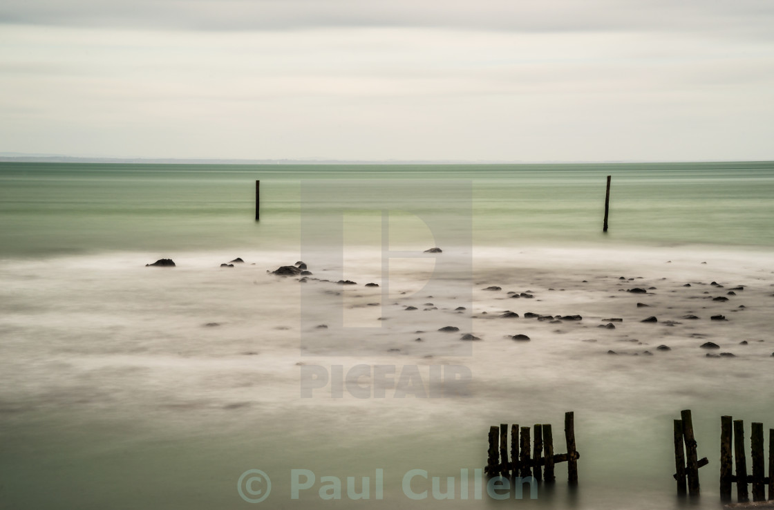 "Wooden posts in the sea." stock image