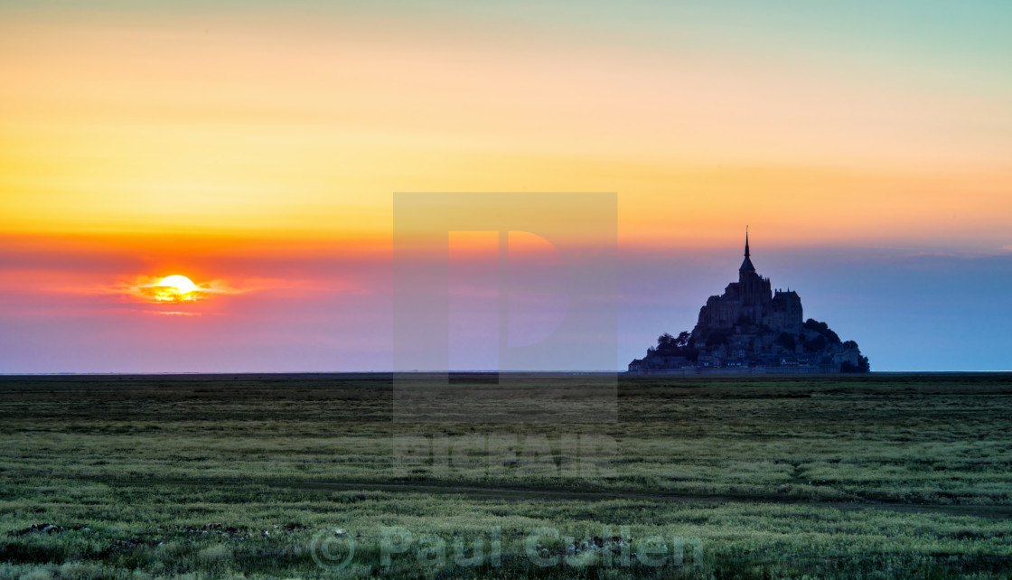 "The Glow of Le Mont Saint-Michel at Sunset." stock image