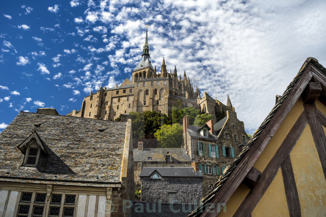 "The Abbey on Le Mont Saint-Michel through the houses." stock image