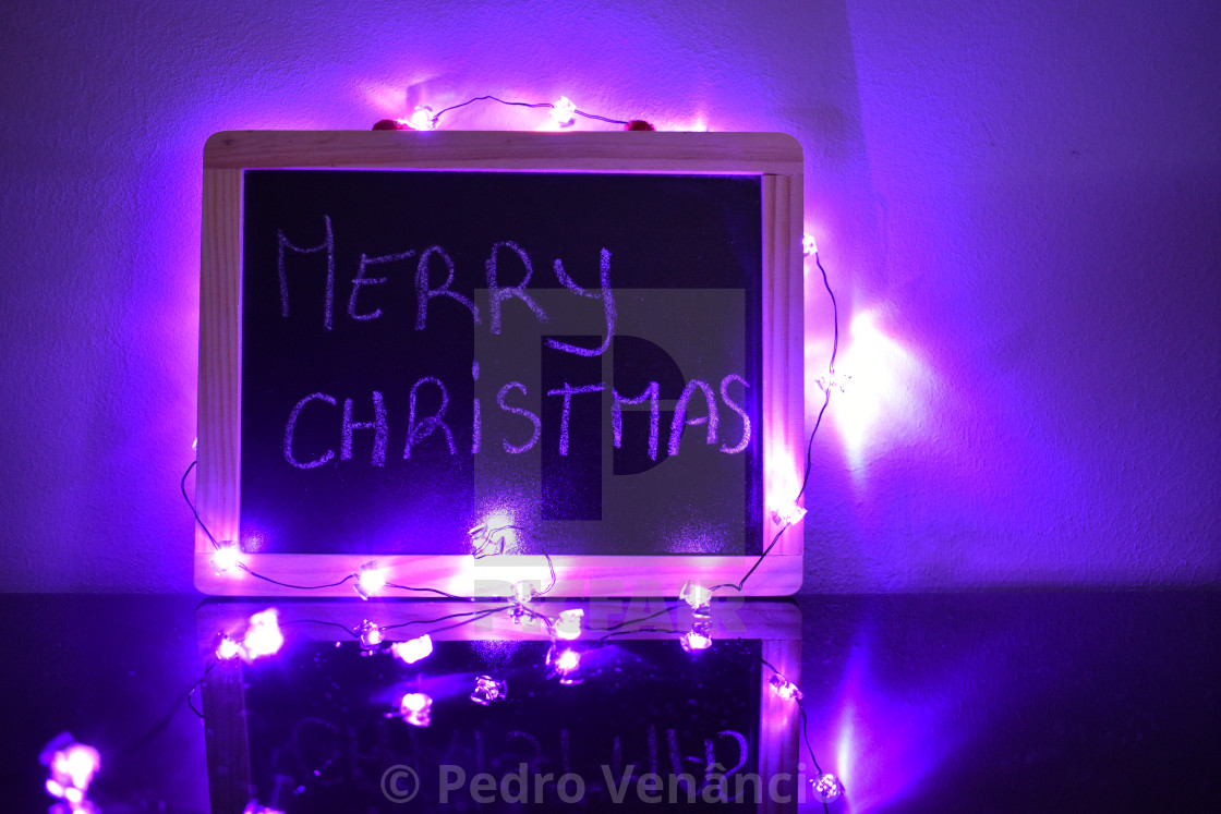 "Merry christmas in chalkboard with lights" stock image