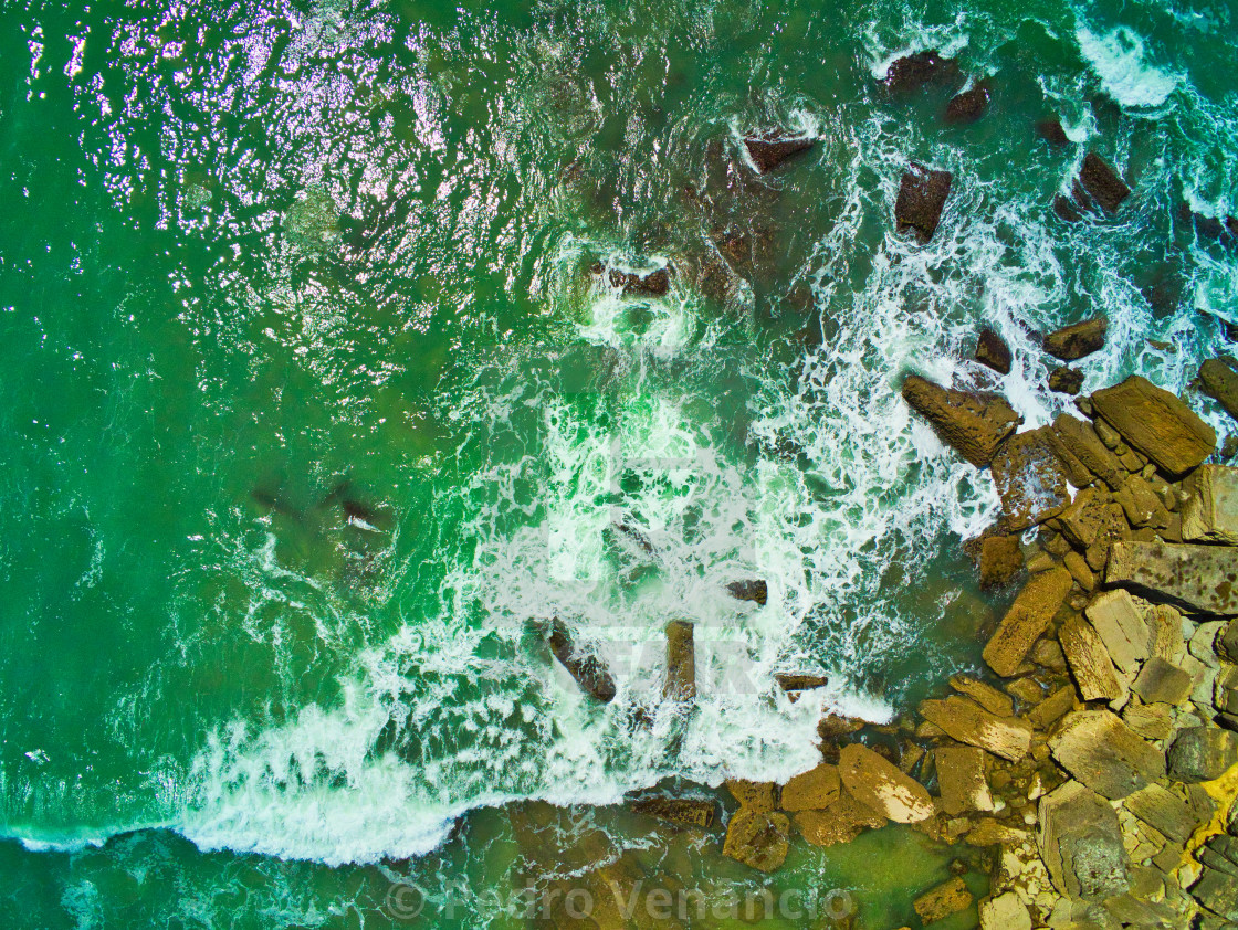 "Eagle view of water and rocks on seaside" stock image