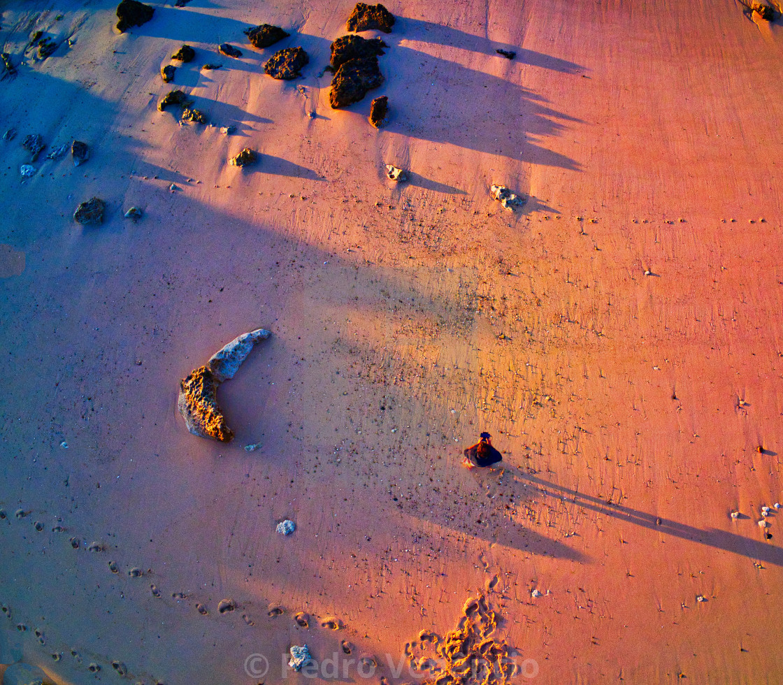 "AERIAL VIEW OF A MEN ALONE ON THE BEACH" stock image