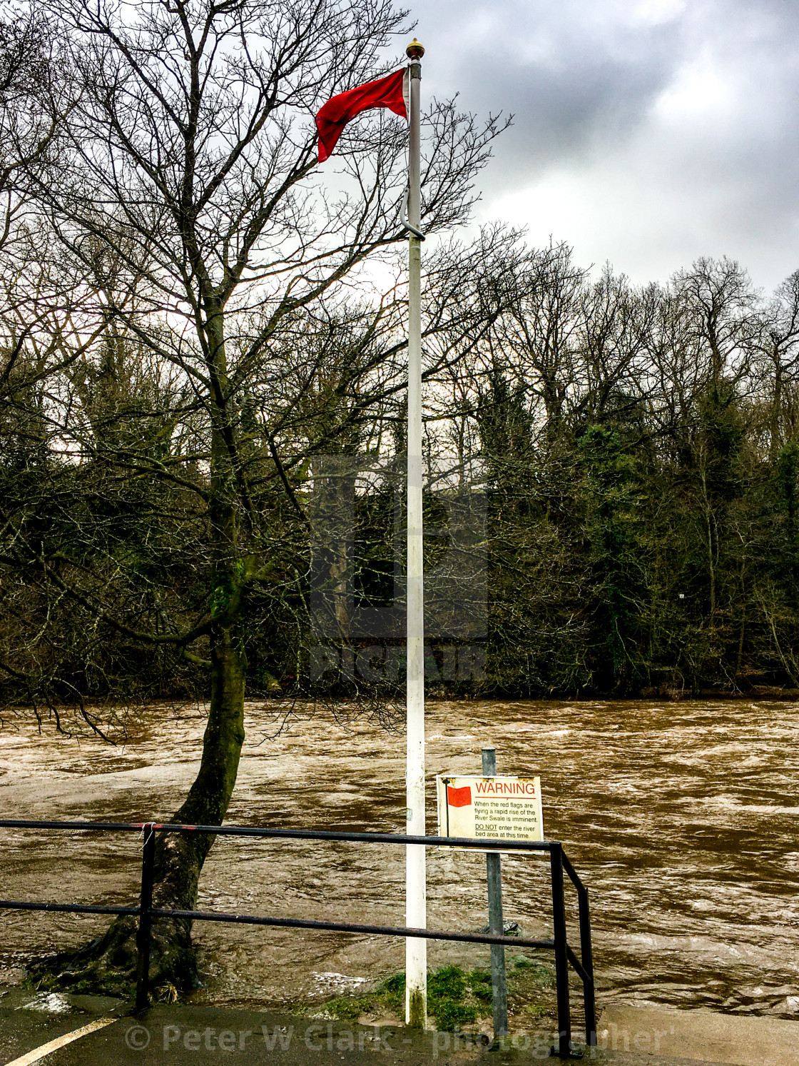 "Richmond, River Swale, Flood Warning, Red Flag" by Peter W. Clark - 'photographer' - £10.00 "Richmond, River Swale, Flood Warning, Red Flag" stock image