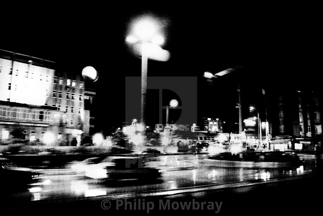 "Grainy and murky view of a car speeding through a street at night" by Philip Mowbray - $12.31 "Grainy and murky view of a car speeding through a street at night" stock image