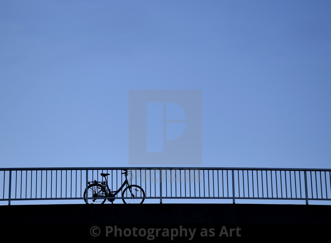 "Lone bicycle on a Bridge, Early Evening" by Photography as Art - $12.35 "Lone bicycle on a Bridge, Early Evening" stock image