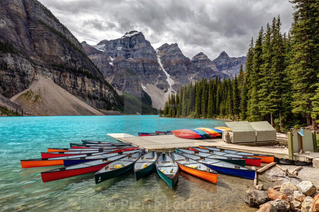 "Colorful Canoes at Moraine Lake" by Pierre Leclerc - $38.00 "Colorful Canoes at Moraine Lake" stock image