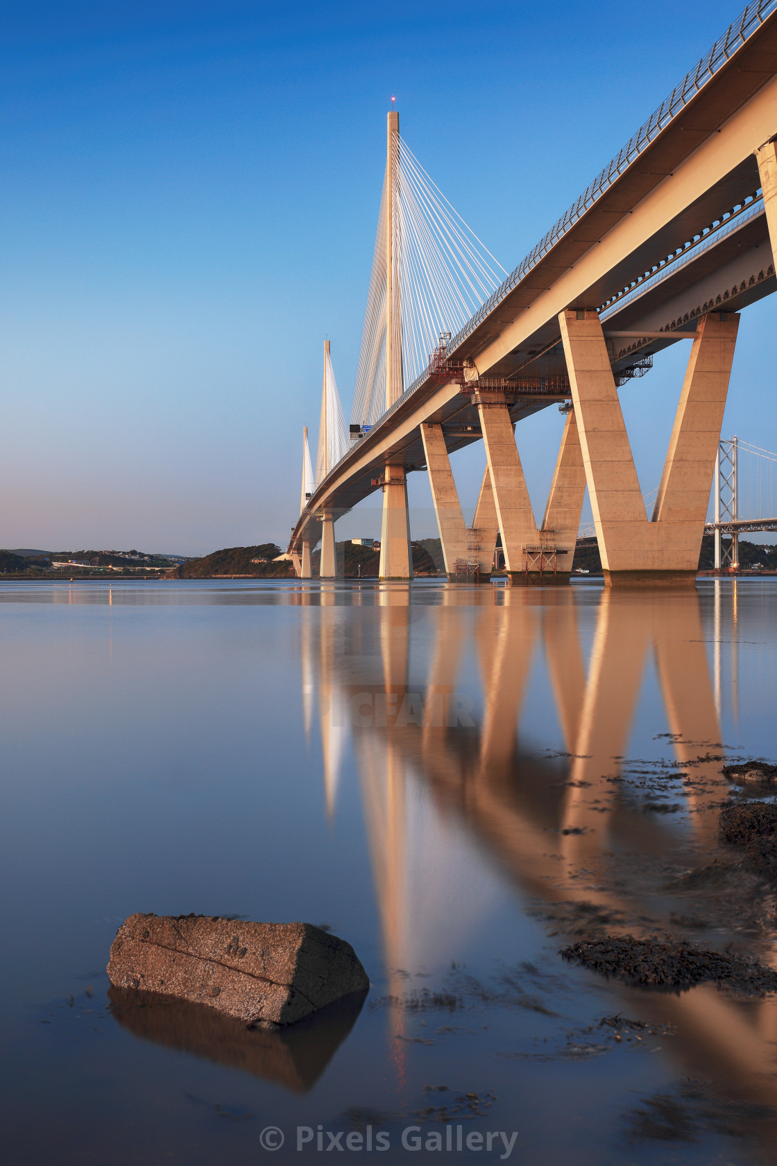 "The new Queensferry crossing bridge reflecting on the Firth of Forth, South Queensferry, Edinburgh." stock image