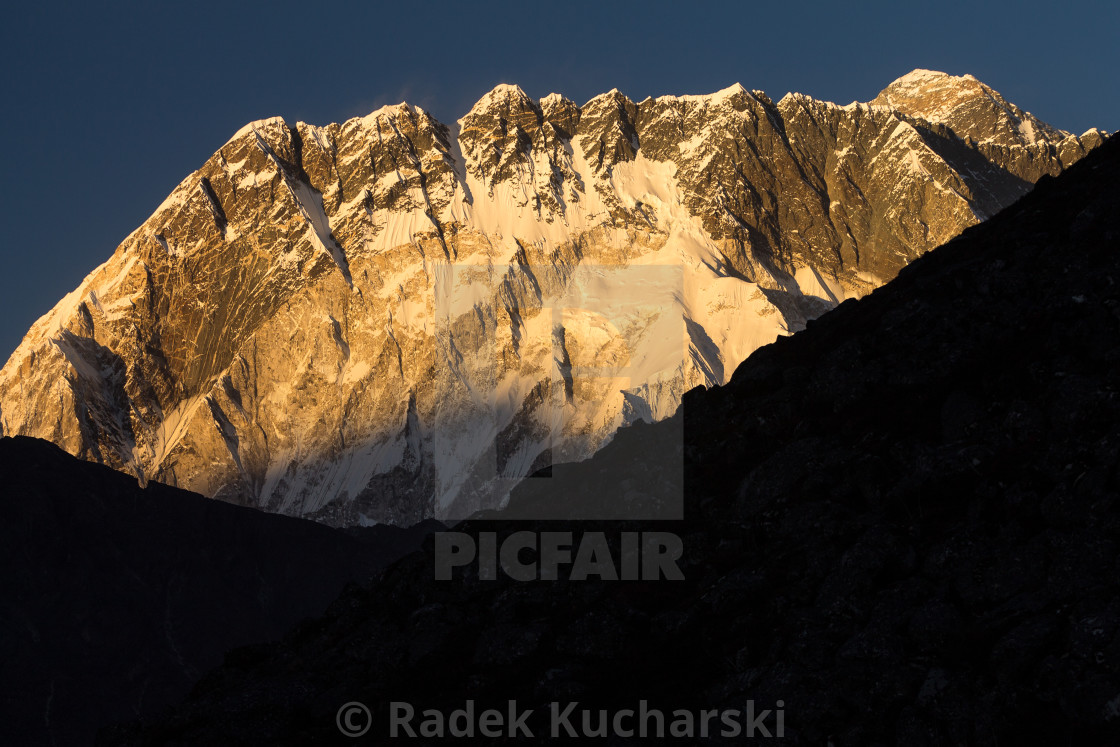 "Nuptse shortly before sunset with Everest rising above its long ridge" stock image