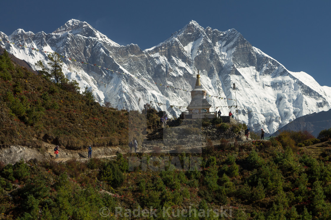 "Trekkers following the traverse above Namche Bazaar en route to Everest Base Camp" stock image